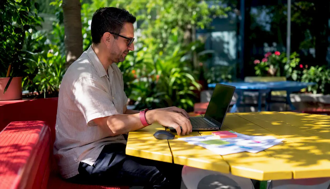 Hands using laptop for Google Workspace shared inbox