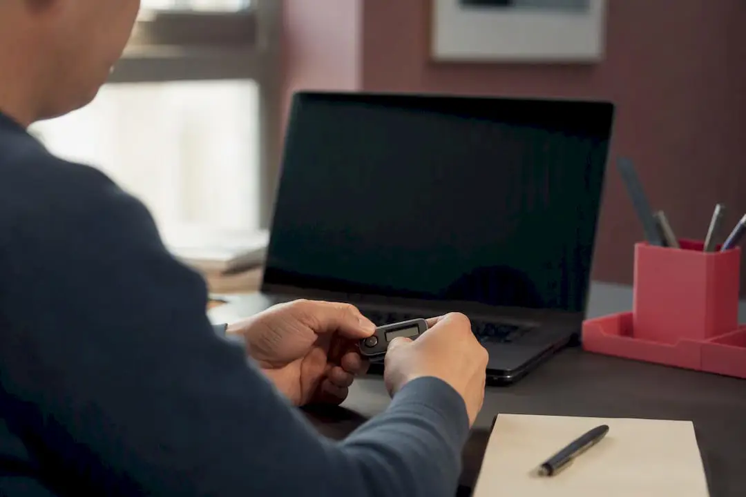 Hands holding multi-factor authentication token