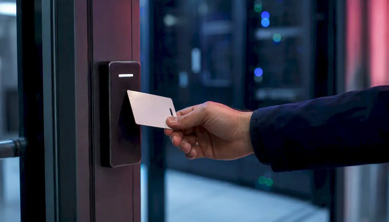 Hand scanning badge at data center entry